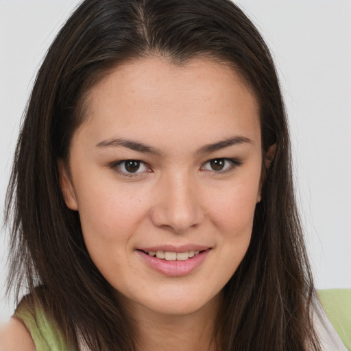 Joyful white young-adult female with long  brown hair and brown eyes