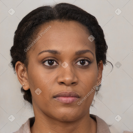 Joyful black young-adult female with medium  brown hair and brown eyes