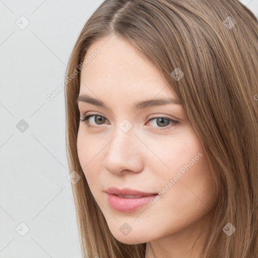 Neutral white young-adult female with long  brown hair and brown eyes