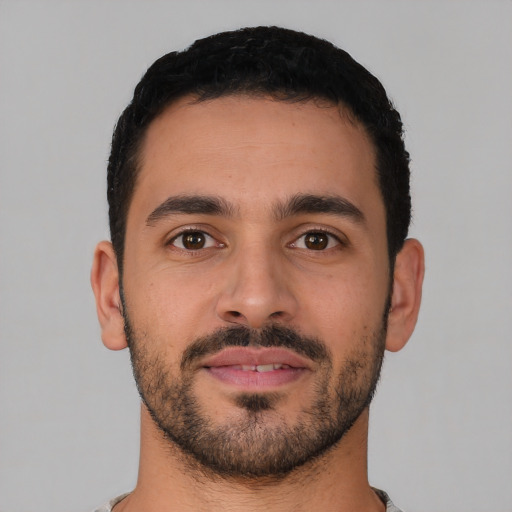 Neutral latino young-adult male with short  black hair and brown eyes