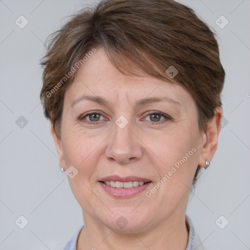 Joyful white adult female with short  brown hair and grey eyes