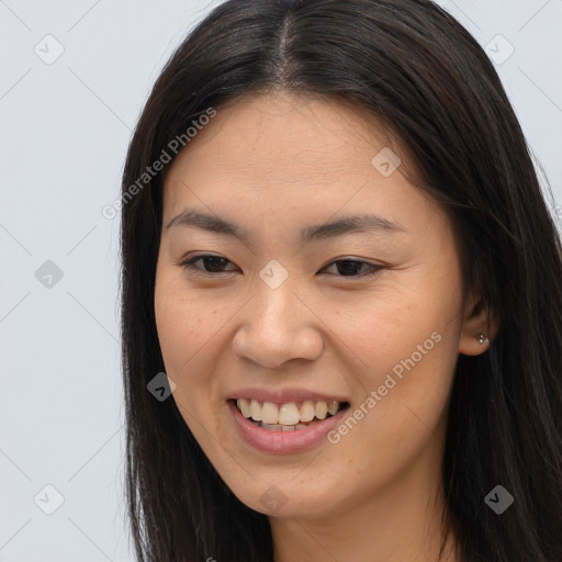 Joyful asian young-adult female with long  brown hair and brown eyes