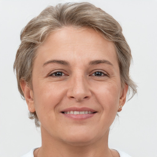 Joyful white adult female with short  brown hair and grey eyes