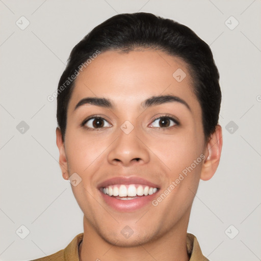 Joyful latino young-adult female with short  black hair and brown eyes