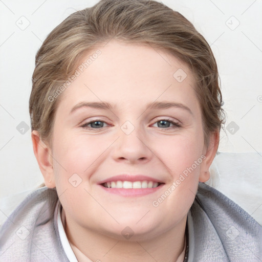 Joyful white young-adult female with medium  brown hair and blue eyes