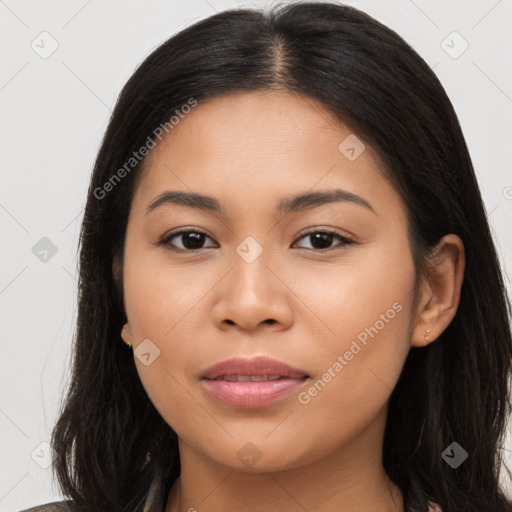 Joyful latino young-adult female with long  brown hair and brown eyes