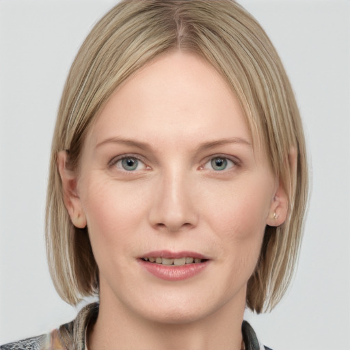 Joyful white young-adult female with medium  brown hair and blue eyes