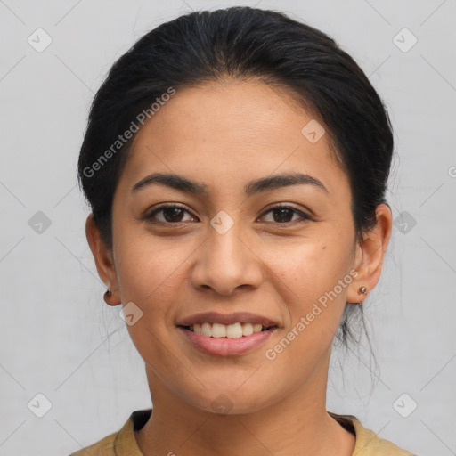 Joyful latino young-adult female with medium  brown hair and brown eyes