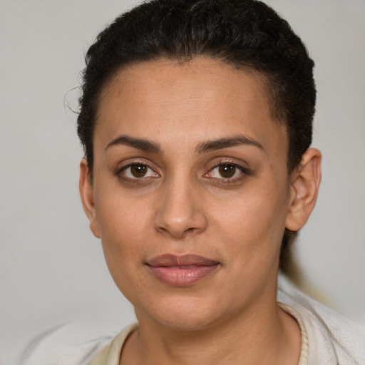 Joyful white young-adult female with short  brown hair and brown eyes