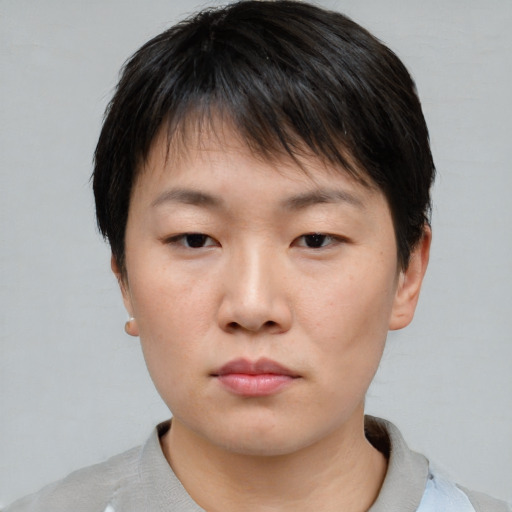 Neutral asian young-adult female with short  brown hair and brown eyes
