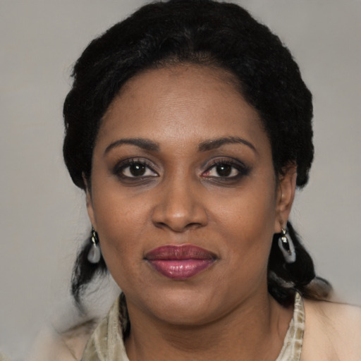 Joyful black young-adult female with medium  black hair and brown eyes