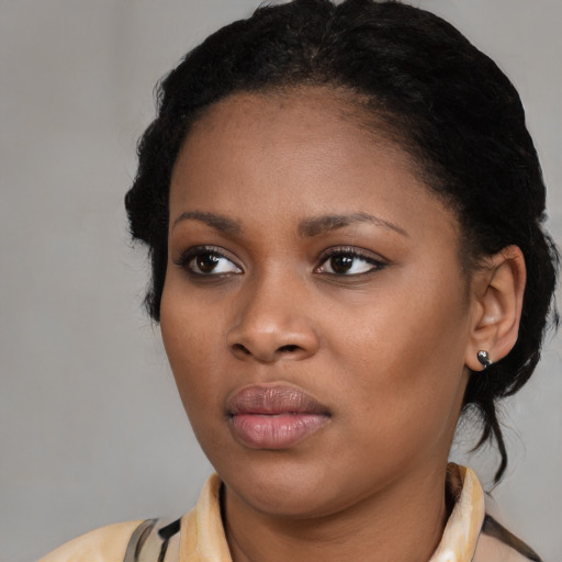 Neutral black young-adult female with medium  black hair and brown eyes