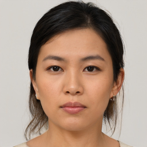 Neutral asian young-adult female with medium  brown hair and brown eyes