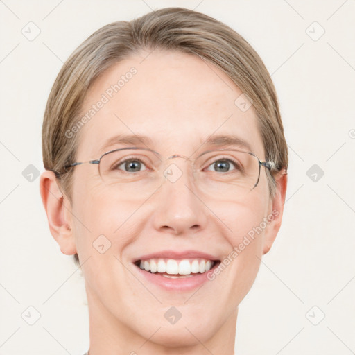 Joyful white adult female with medium  brown hair and blue eyes