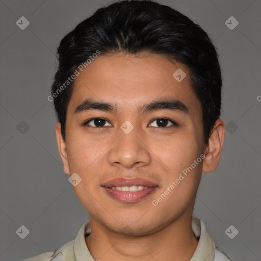 Joyful asian young-adult male with short  brown hair and brown eyes