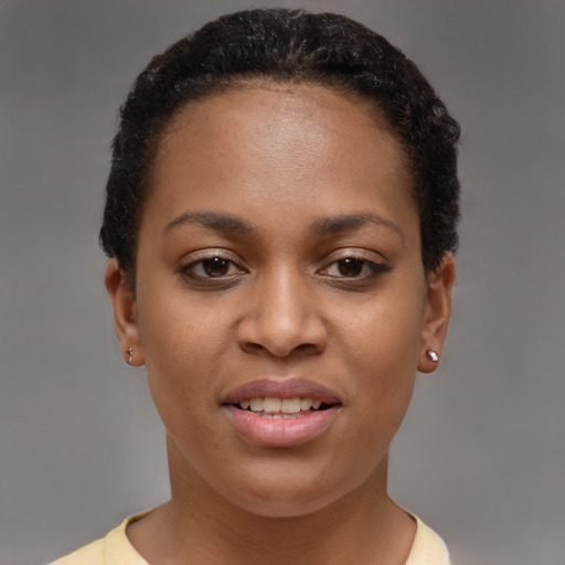 Joyful black young-adult female with short  brown hair and brown eyes