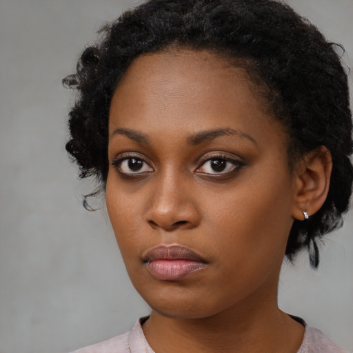 Neutral black young-adult female with short  black hair and brown eyes