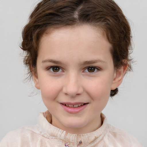 Joyful white child female with short  brown hair and brown eyes