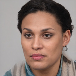 Joyful latino young-adult female with short  brown hair and brown eyes