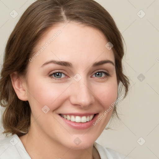 Joyful white young-adult female with medium  brown hair and green eyes