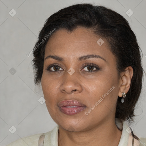 Joyful black adult female with medium  brown hair and brown eyes