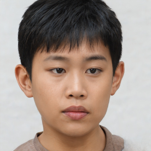 Neutral asian child male with short  brown hair and brown eyes
