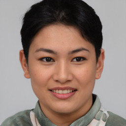 Joyful asian young-adult female with short  brown hair and brown eyes