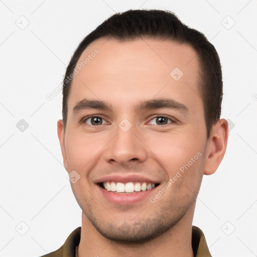 Joyful white young-adult male with short  brown hair and brown eyes