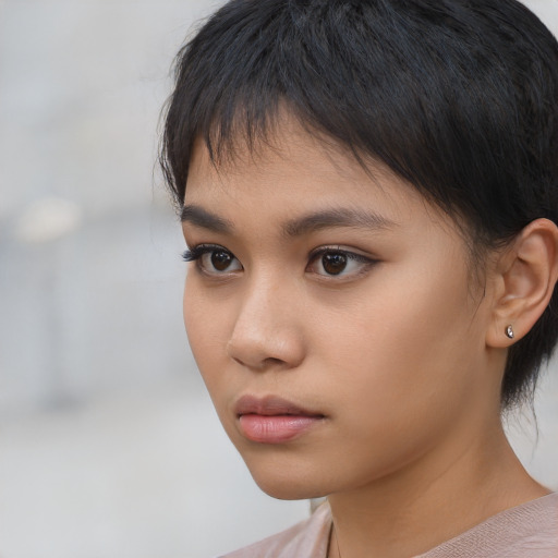 Neutral asian child female with medium  brown hair and brown eyes