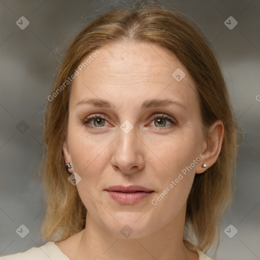 Joyful white adult female with medium  brown hair and grey eyes