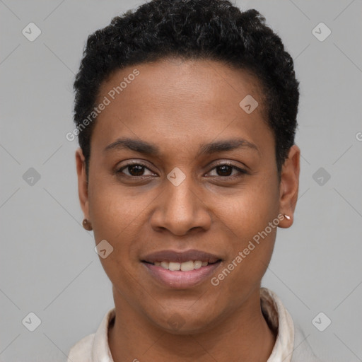 Joyful black young-adult female with short  black hair and brown eyes