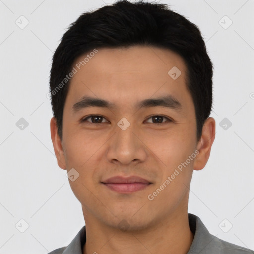 Joyful latino young-adult male with short  black hair and brown eyes