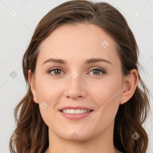 Joyful white young-adult female with long  brown hair and grey eyes