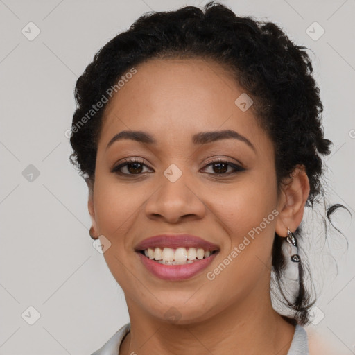 Joyful latino young-adult female with long  black hair and brown eyes