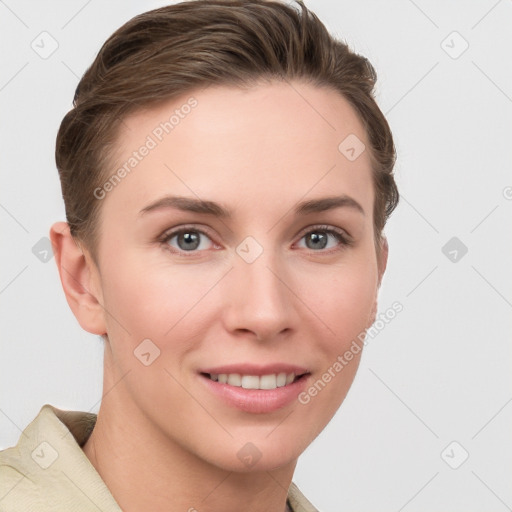 Joyful white young-adult female with short  brown hair and grey eyes