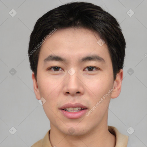 Joyful asian young-adult male with short  black hair and brown eyes