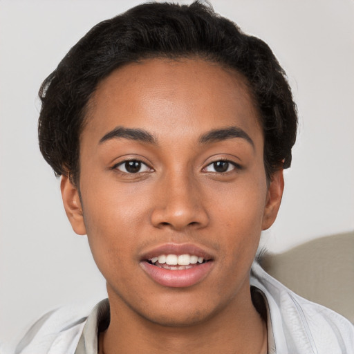 Joyful latino young-adult female with short  brown hair and brown eyes