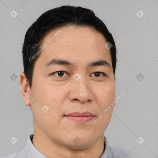 Joyful asian young-adult male with short  black hair and brown eyes