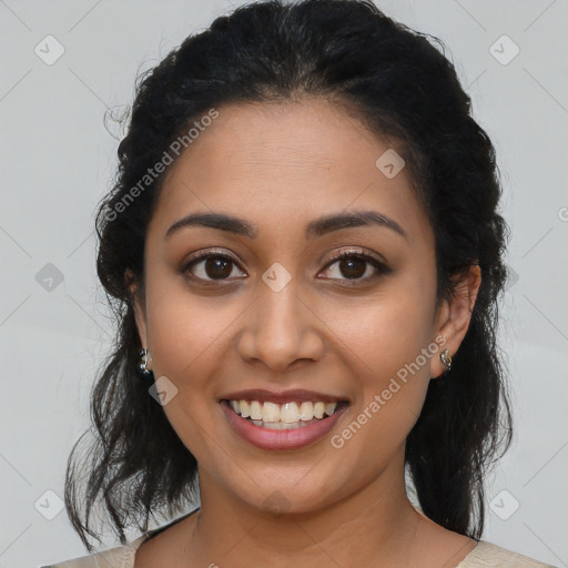 Joyful latino young-adult female with medium  brown hair and brown eyes