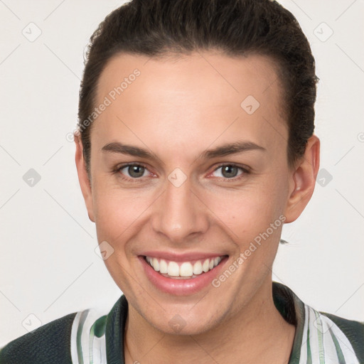 Joyful white young-adult female with short  brown hair and brown eyes