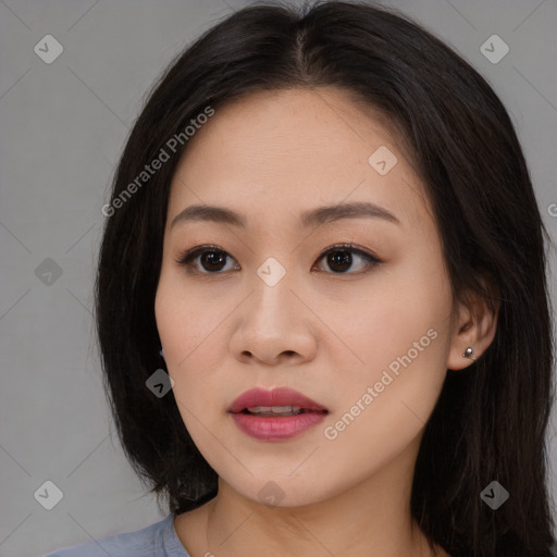 Joyful asian young-adult female with long  brown hair and brown eyes