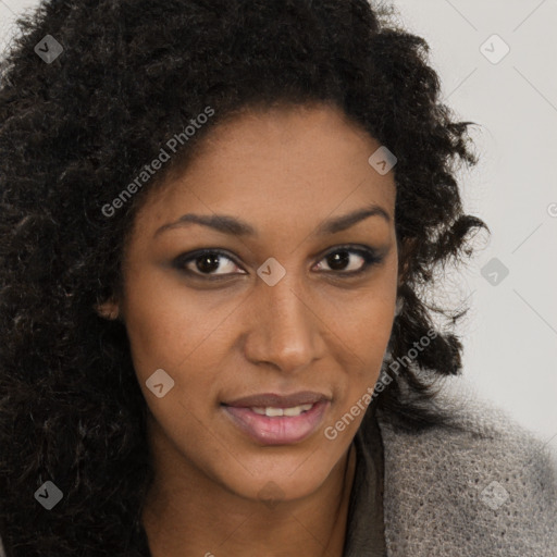 Joyful black young-adult female with long  brown hair and brown eyes