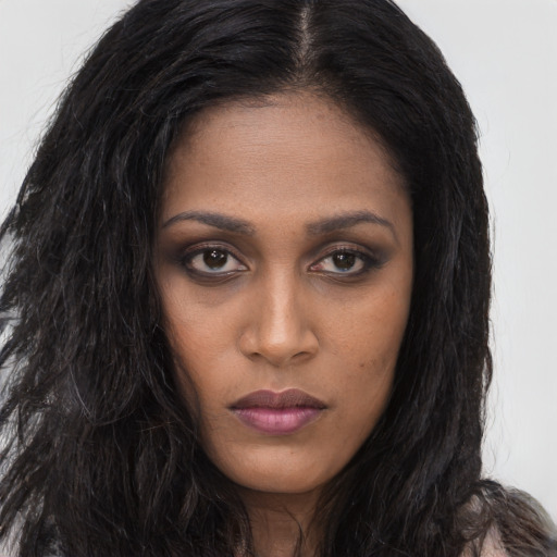 Neutral black young-adult female with long  brown hair and brown eyes