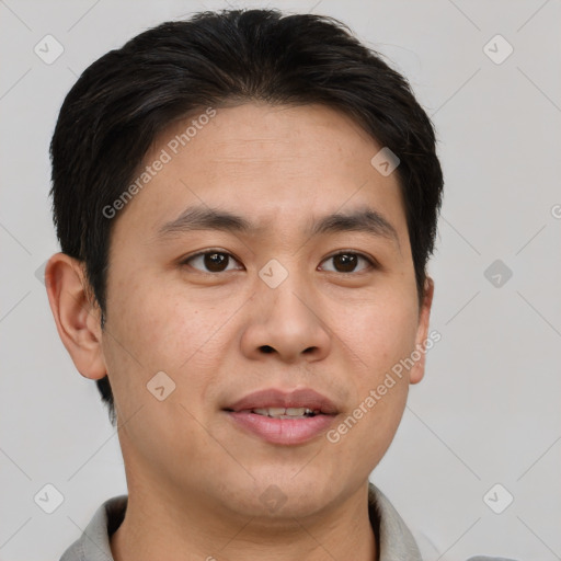 Joyful asian young-adult male with short  brown hair and brown eyes