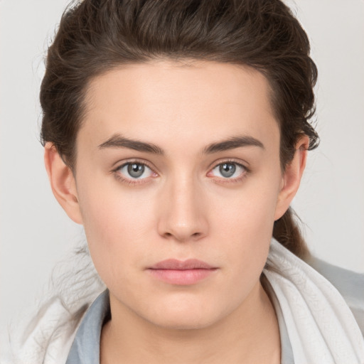 Neutral white young-adult female with short  brown hair and brown eyes