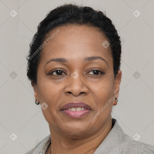 Joyful black adult female with short  brown hair and brown eyes