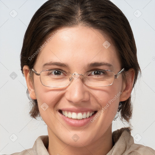 Joyful white adult female with medium  brown hair and grey eyes