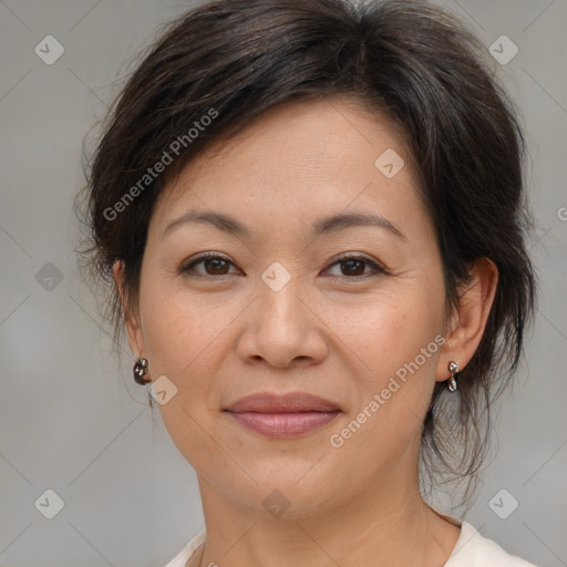 Joyful white adult female with medium  brown hair and brown eyes