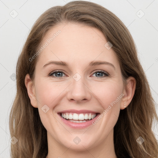 Joyful white young-adult female with long  brown hair and grey eyes