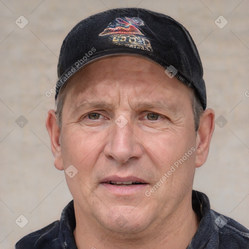 Joyful white adult male with short  brown hair and grey eyes